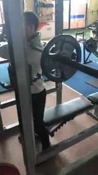 Male Front Barbell Squat To A Bench demonstration